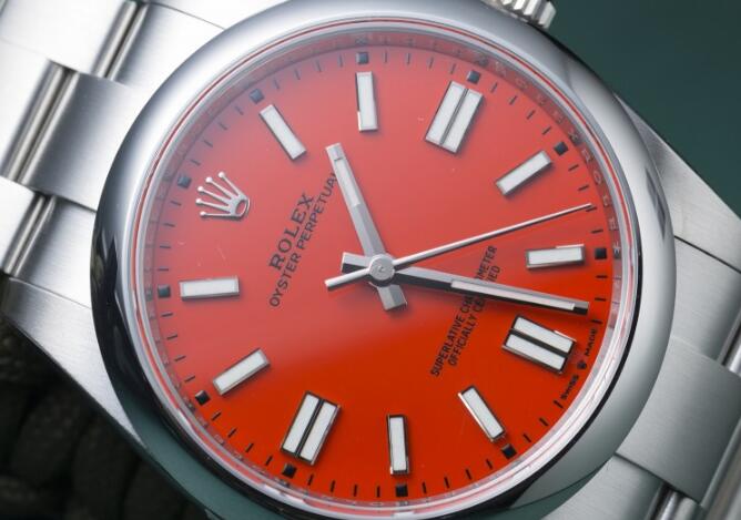 The coral red dial makes the best copy Rolex more eye-catching.